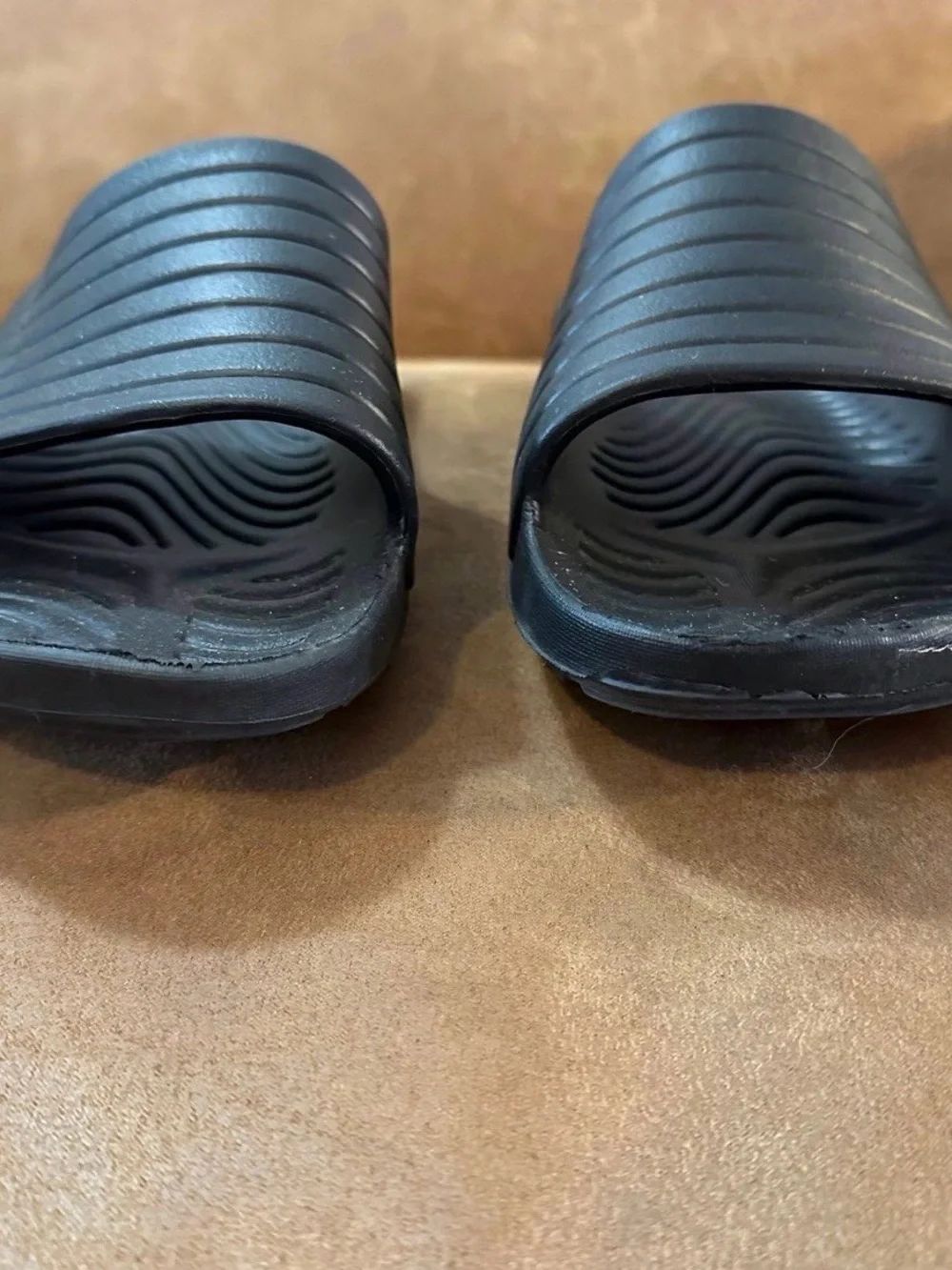 Black slides, men’s size 12, in good-worn once condition